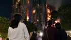 Fire engulfs Hong Kong residential blocks, killing at least 13