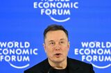 Elon Musk makes Davos debut with promise of robots for all