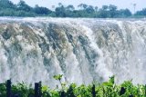 Why is Zimbabwe named the country to visit in 2025?