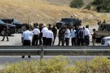 Kurdish PKK militants begin handing over weapons in cave in Iraq