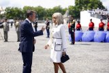 Macron sues right-wing US podcaster over claim French first lady born male
