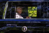 Trump Motorcade Gets A Very Blunt Message From A Lone Protester