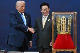 South Korea Gifts Trump A Literal Crown Amid 'No Kings' Protests