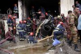 At least 19 killed, scores injured as Bangladesh air force jet crashes into college campus