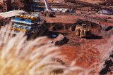 Trade tension and weak demand put global iron ore market under pressure
