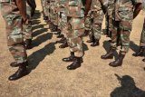 12 soldiers in court in connection with the murder of a Hawks investigator