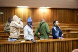 Wife confesses to hiring hitmen to kill her husband