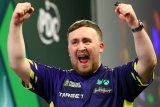 Am I the only expat who never watched darts until Luke Littler – and I’ve adopted him?