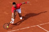 Djokovic beats Norrie to join Nadal in French Open century club