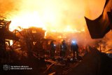 Russian attacks on Ukraine kill two, set private homes on fire
