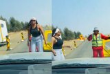 Viral video: Roadworker and woman share joyful dance at roadblock