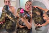 Woman takes bath with giant snake in viral footage, SA reacts – WATCH
