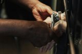 Cop accused of hiding key evidence in gang-related murder