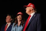 Trump celebrates tax bill victory at Iowa fairground rally