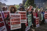 Hundreds protest for climate solutions