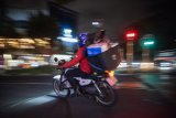 In photos: Bike delivery guys risk life and limb to deliver our goods