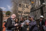 Protesters call for scrapping changes to labour laws