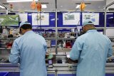 Factory activity slips as metals and wood weigh on output