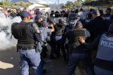 Police fire stun grenades at PAGAD protesters