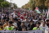 Hundreds march to demand release of activists detained by Israel