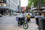 In photos: Teenager supports her family using an e-bike