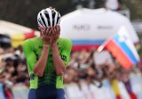 Flamboyant Pogacar retains world title in Kigali to cement legacy