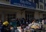 Displaced flood victims on the streets after eviction from Durban hotel over unpaid bills