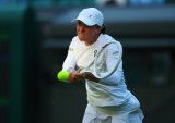 Swiatek ends Tauson's run to fly into quarters, Bencic downs Alexandrova