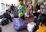 Displaced Sudanese stream home from Egypt after army retakes Khartoum