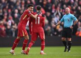 Liverpool edge past Wolves to go seven points clear at top