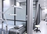 Government denounces denial of clinic access to foreign nationals