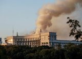 Infant among three killed in Russian attack that sets ablaze seat of Ukraine government