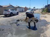 Human Rights Commissioner dodges overflowing sewage in Cape Town
