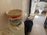 Staff at this government building have to carry buckets of water to flush toilets
