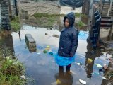 Khayelitsha residents scoop buckets of water from flooded homes