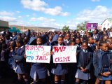 School children march for better policing after taxi driver allegedly rapes girl