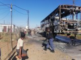Protesters throw human waste outside clinic and torch vehicles