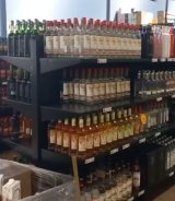 Metro cops seize about 1,500 bottles of illicit alcohol, arrest illegal migrants in Phoenix raid