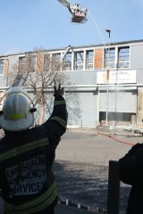 Two held and more arrests expected after suspects set fire to home affairs office