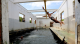 Abandoned sewage plant now used as swimming pool