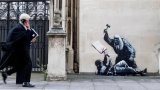 Anger as Banksy mural of judge beating protester removed
