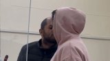 Passion in the dock: Accused share a kiss before dropping bail bid
