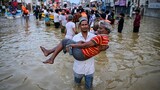 Race to get aid to Asia flood survivors as death toll nears 1,200