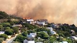 Firefighters battle wildfire threatening residential areas near Glencairn Express Way