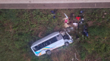 Three dead and at least a dozen injured after bus plunges off bridge
