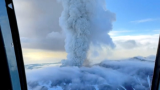 Russia cancels tsunami warning for Kamchatka after quake, dormant volcano erupts
