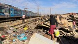 Thousands of families live on railway reserves without water, electricity or rubbish collection