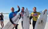 AT THE BEACH | Border on crest of a wave at surfing championship